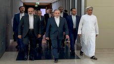 In this handout photo obtained from Irans foreign ministry delegation on February 6, 2026, Irans Foreign Minister Abbas Araghchi (C) arrives for a meeting in Muscat. Iran and the United States began talks on February 6 in Oman, with Washington refusing to rule out military action against its foe if diplomacy fails while the Islamic republic vowed to defend itself against "any excessive demands". (Photo by IRAN FOREIGN MINISTRY / AFP) / NO USE AFTER FEBRUARY 15, 2026 22:00:00 GMT - RESTRICTED TO EDITORIAL USE - MANDATORY CREDIT "AFP PHOTO / IRAN FOREIGN MINISTRY" - HANDOUT - NO MARKETING NO ADVERTISING CAMPAIGNS - DISTRIBUTED AS A SERVICE TO CLIENTS