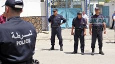 Algerian policemen stand guard the street prior to the arrival of Algeria's former prime minister Abdelmalek Sellal who's being driven to custody at the El Harrach prison in the suburbs of the capital Algiers, on june 13, 2019. Sellal was remanded in custody on June 13 after appearing before a judge as part of an anti-corruption investigation, state media reported. The decision against Sellal, an ally of ex-president Abdelaziz Bouteflika, comes a day after former premier Ahmed Ouyahia was also remanded in custody. The two politicians are among numerous high-profile figures in Algeria to be drawn into graft probes since the ailing Bouteflika was forced to step down in April following weeks of mass protests. (Photo by AFP)