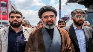 (FILES) In this picture obtained from Iran's ISNA news agency, Mojtaba Khamenei (C), son of Iran's supreme leader Ayatollah Ali Khamenei, walks along a street in Tehran on May 31, 2019. Iran marked the appointment of Ayatollah Mojtaba Khamenei to replace his father as its supreme leader with a new barrage of missiles against Israel and the Gulf states on March 9, 2026, as the Middle East war sent oil prices soaring. (Photo by Hamid FOROUTAN / ISNA / AFP)