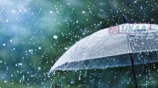 Transparent umbrella under heavy rain against water drops splash background. Rainy weather concept.